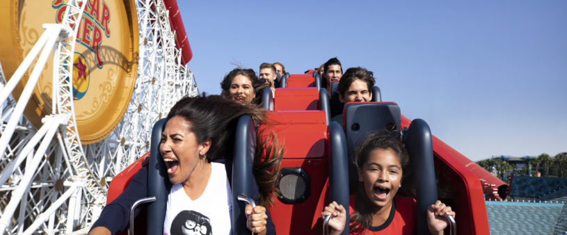 Mother and son riding a roller coaster at California Adventure Park.